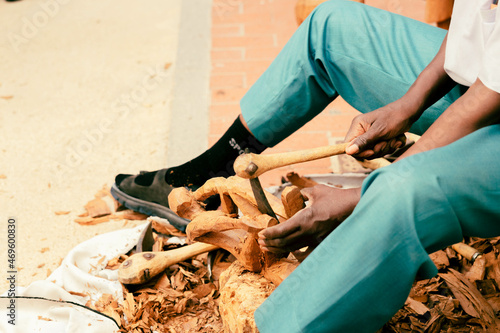 Fotografija African craftsman works on the city street.