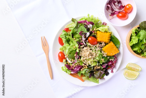 Fresh organic vegetables with quinoa salad on white background ready to eating, Healthy Vegan food, Top view