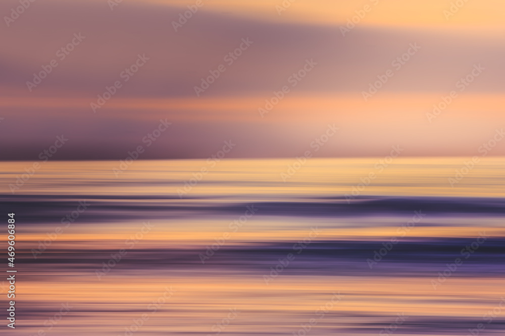Sunset over the ocean, abstract seascape in bright vibrant purple and pink colors, motion blur