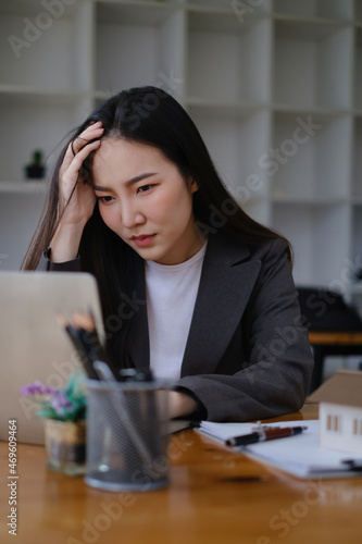 фотографія Frustrated stressed business owner or accountant sitting in an office because covid-19 has disappoint