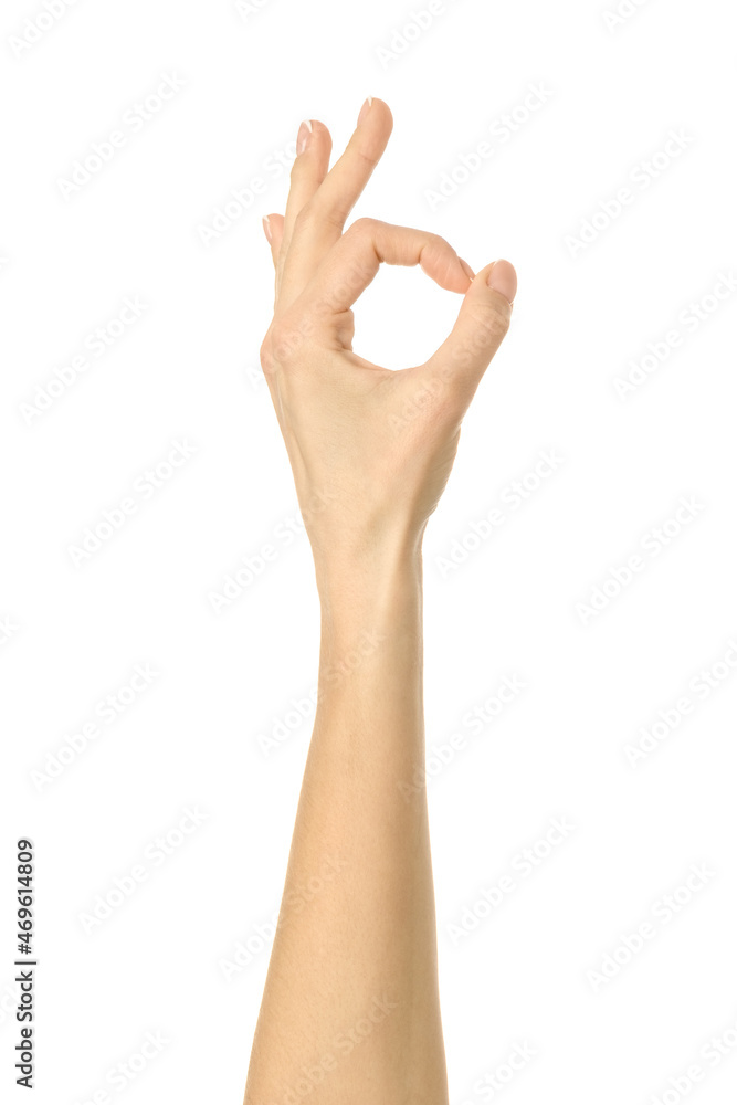 Ok sign. Woman hand gesturing isolated on white Ok sign. Woman hand gesturing isolated on white