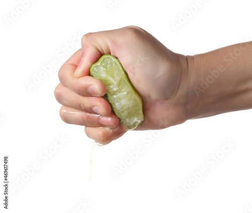 Hand squeeze green lime on white background