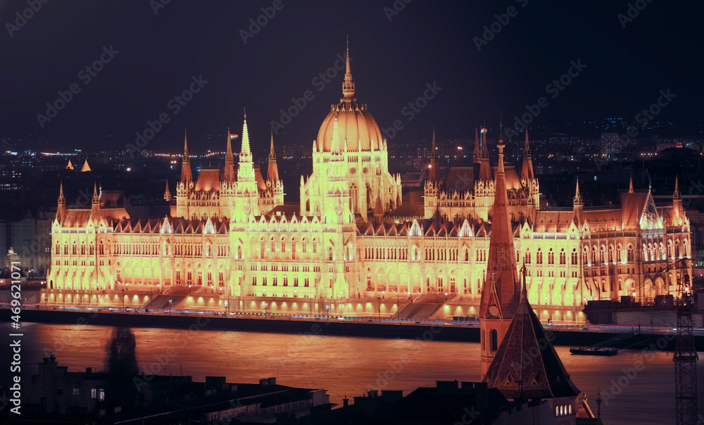 Illuminated Hungary parliament residence on bank of Danube at night, Budapest