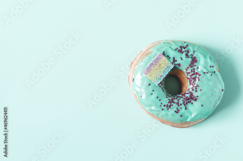 The banner is a bright donut with colored glaze on a light background. Colorful donuts close-up