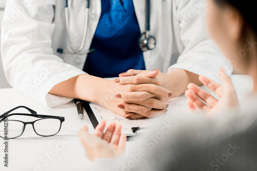 Bilde på lerret Close up of Doctor discussing and consulting diagnosis disease patient medical in an examination room at a hospital, Medical and Health Care Concept