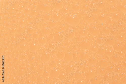 The orange background with water drops.