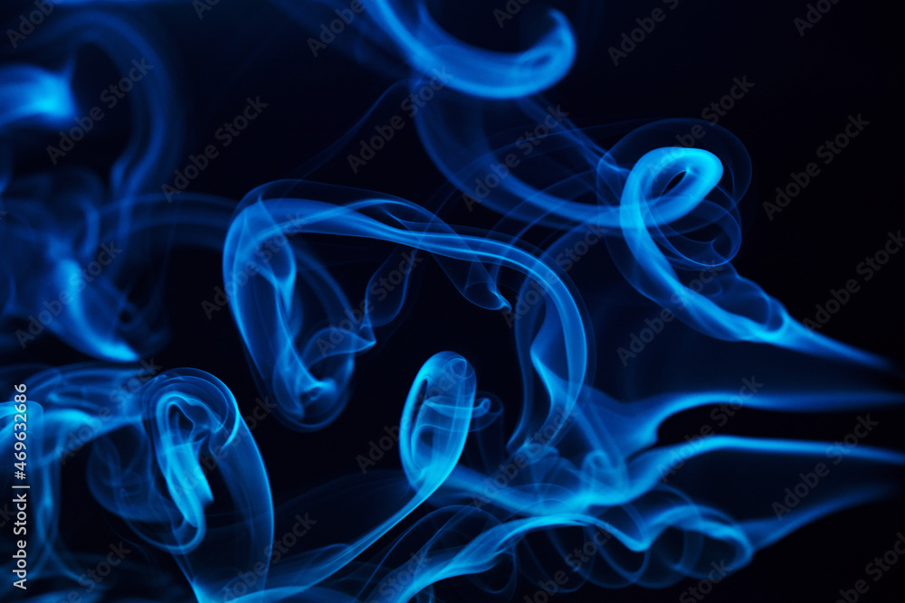 Fototapeta premium Abstract smoke Weipa. Personal aroma vaporizers. Concept of alternative non-nicotine smoking. Color vape smoke on dark background. Electronic Cigarette. Evaporator. Steaming. Blurry image, soft focus