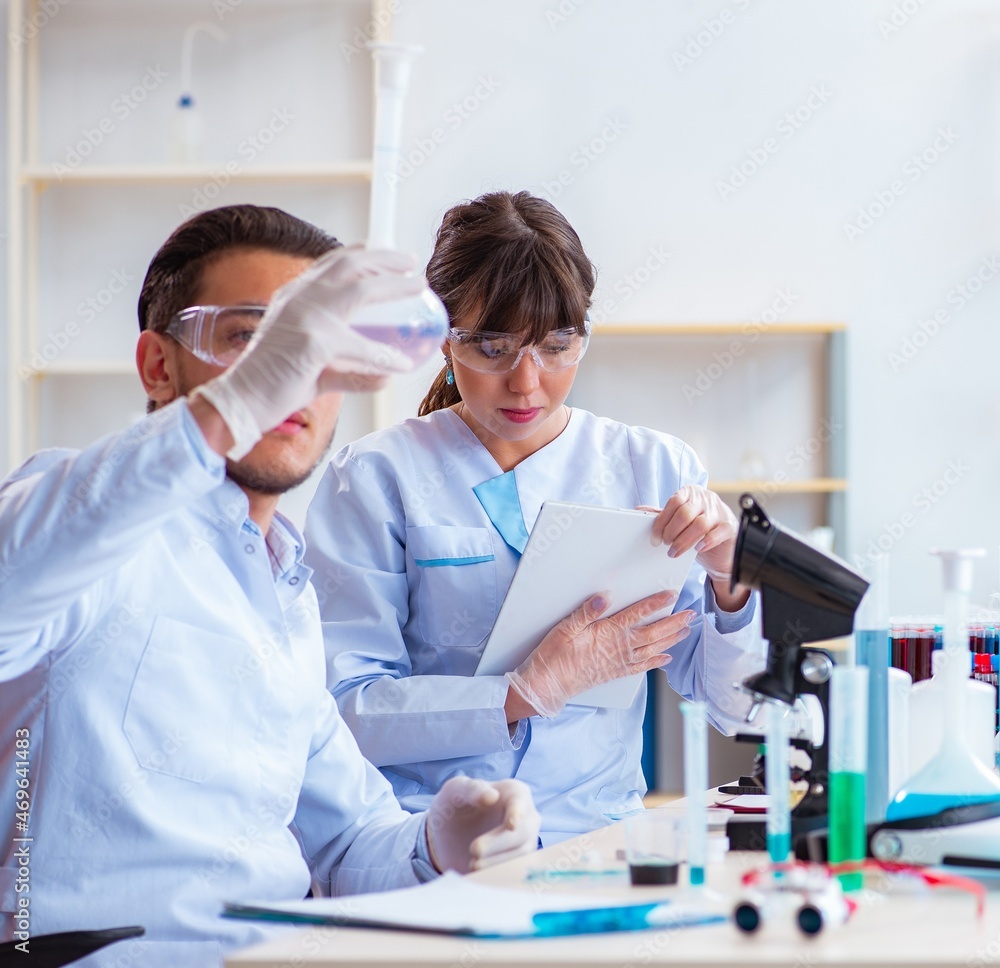 Team of chemists working in the lab Team of chemists working in the lab