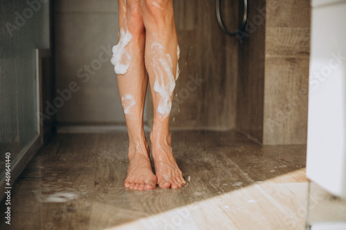 Female legs close up in shower