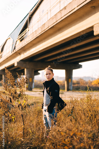 boy under railway bridge