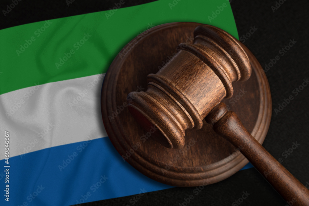 Judge Gavel and flag of Sierra Leone. Law and justice in Sierra Leone. Violation of rights and freedoms