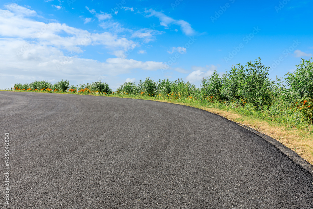 Empty asphalt road and blue sky with white clouds. Empty asphalt road and blue sky with white clouds.