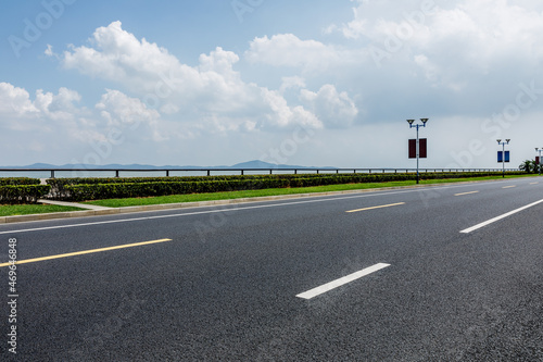 Empty asphalt road and blue sky with white clouds.Road background.