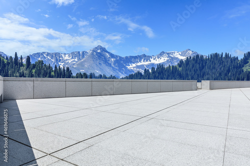 Empty square floor and snow mountain background.