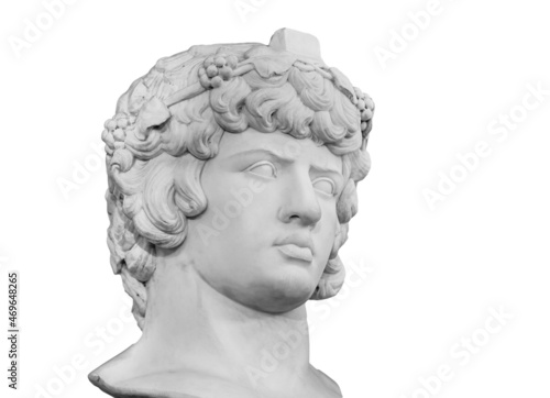 Gypsum copy of famous ancient statue Antinous head isolated on a white background. Plaster antique sculpture young man face. Renaissance epoch. Portrait