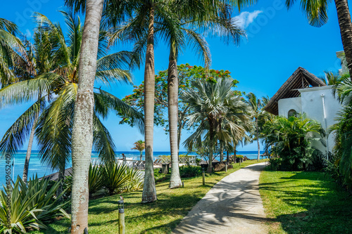 Tropical resort hotel beach paradise. Summer vacation on the sea coast. Splendid panoramic view of beautiful beach. Luxury holiday in Mauritius island. Blue sky palm trees. High quality photo