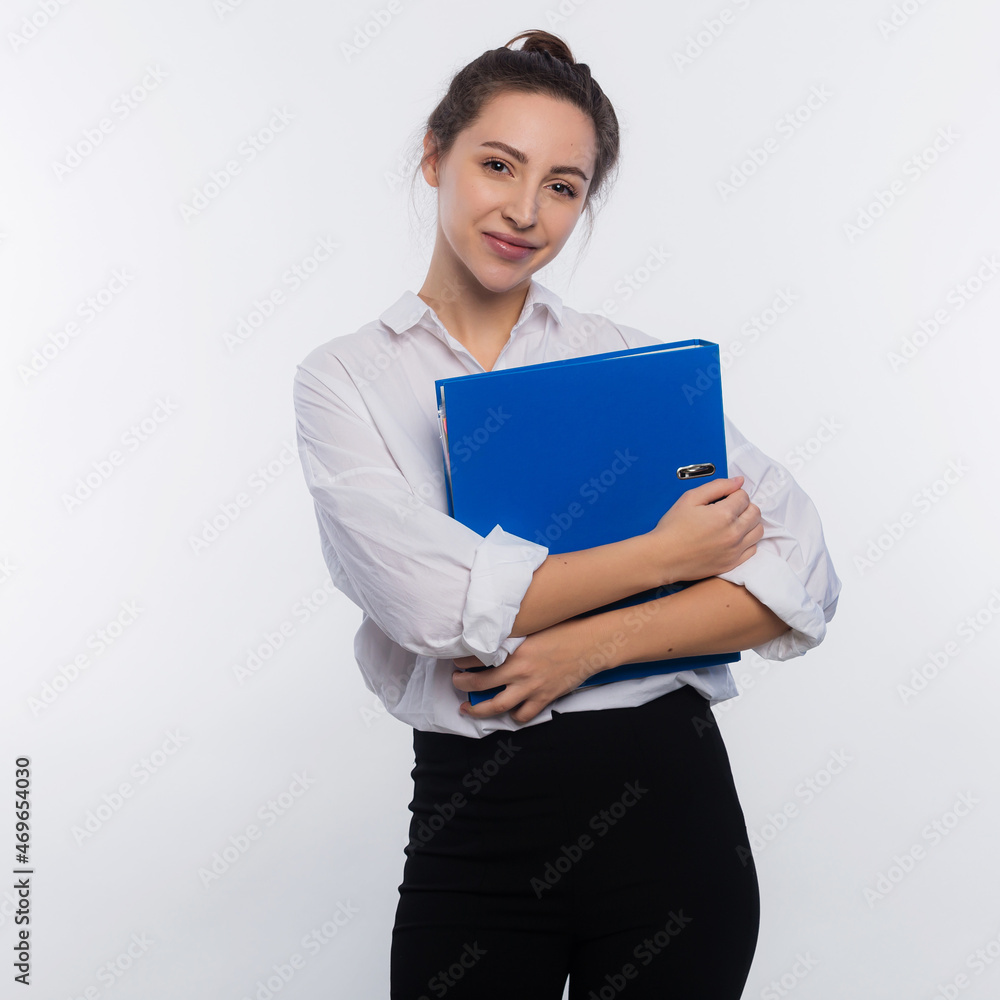 Young and cute business woman hold a document in her hands isolated on white copy space Young and cute business woman hold a document in her hands isolated on white copy space