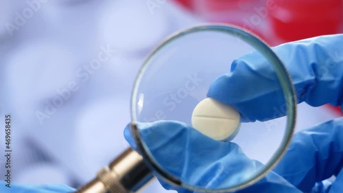 Wallpaper Mural magnifying glass, pills and tablets on blue background. checking ingredients and effectiveness of medicine Torontodigital.ca