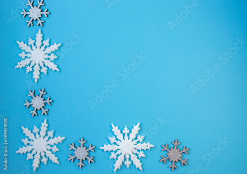 Christmass flatlay white snowflakes in shape frame 
