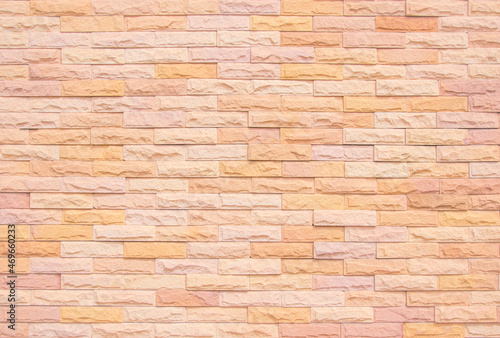 Orange and white brick wall texture background. Brickwork and stonework flooring interior rock old. Background old vintage brick wall backdrop