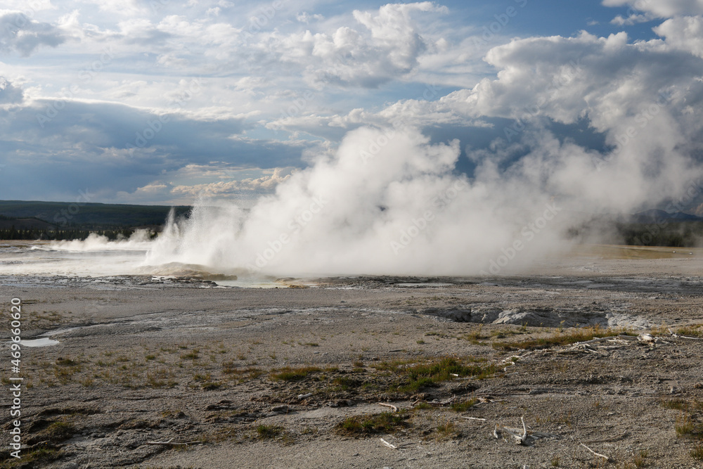 Yellowstone National Park.
Spooky portion of landscape in Yellowstone National Park featuring a desert area caused by acidic soil and erupting geysers.