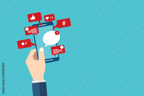 Social Media Smart Phone, Viral content, social media marketing and social media activity - likes, shares and comments popping up on the mobile screen