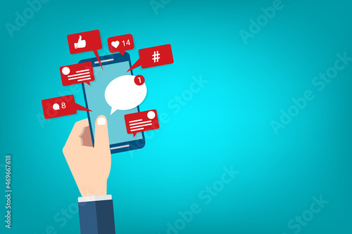 Social Media Smart Phone, Viral content, social media marketing and social media activity - likes, shares and comments popping up on the mobile screen © madedee