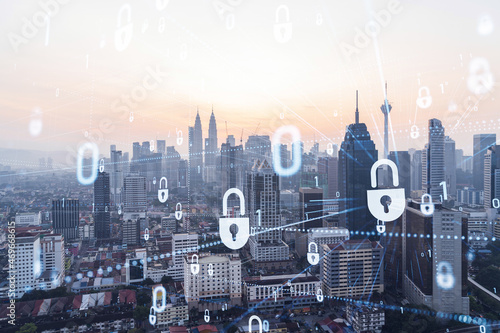 Photography Padlock hologram on sunset panoramic cityscape of Kuala Lumpur, Malaysia, Asia