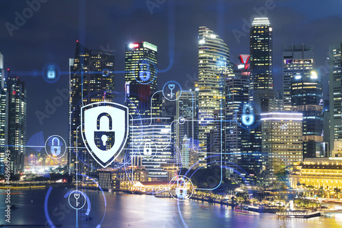 Glowing padlock hologram, night panoramic city view of Singapore, Asia. The concept of cyber security to protect companies. Double exposure.