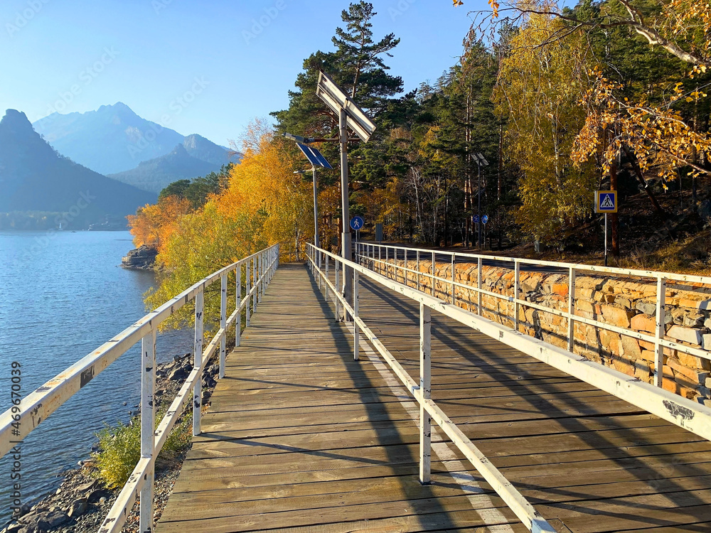 Burabay national Park with kokshe mount and lake. Beautiful brich forest in autumn time during day. Wooden walking bridge in a national park - Kazakhstan.