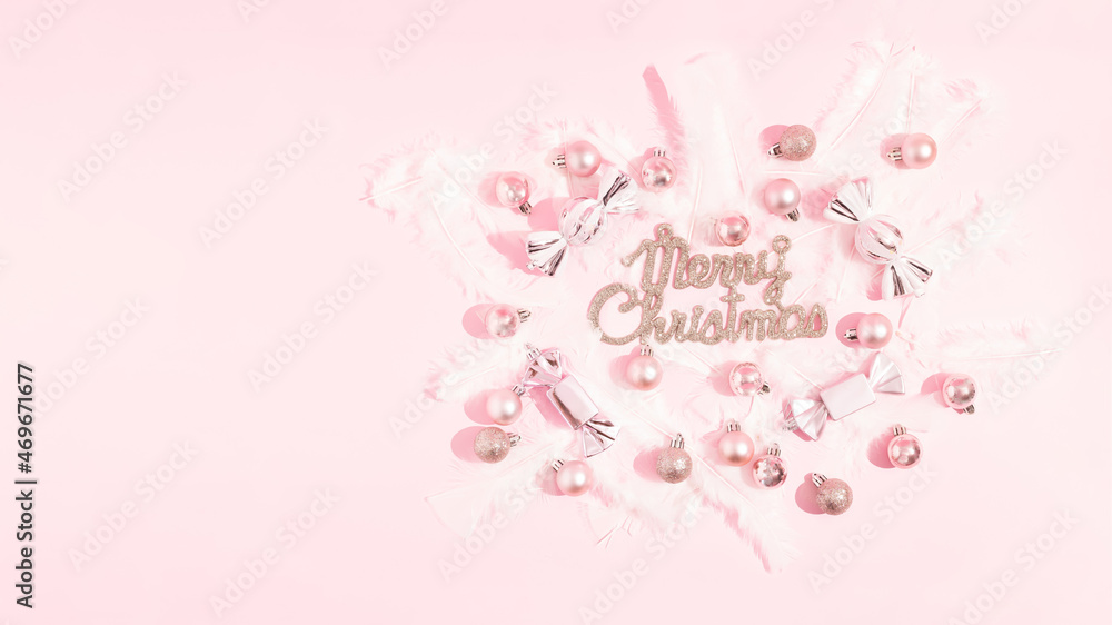 Modern luxury Christmas poster with shiny pink decorations on a pink background. Christmas invitation, background. Creative design greeting card. Top view. Modern luxury Christmas poster with shiny pink decorations on a pink background. Christmas invitation, background. Creative design greeting card. Top view.