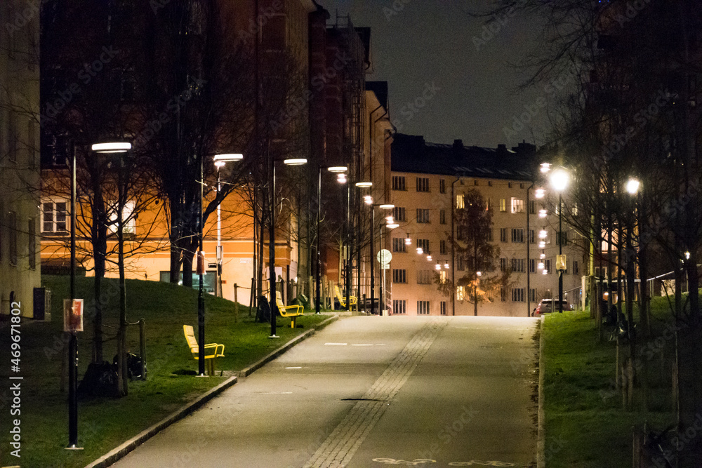 Stockhom, Sweden  People walking on Magnus Ladulasgatan at night.