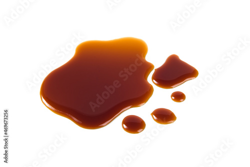 Spilled Soy Souse isolated on white background photo