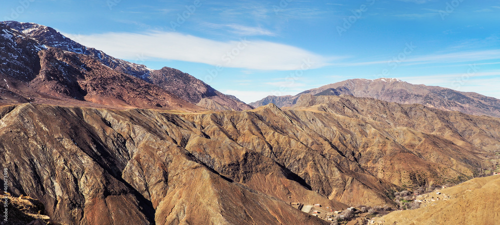 Panorama of Tizi n'Tichka mountain pass in High Atlas range, Morocco, small houses at background