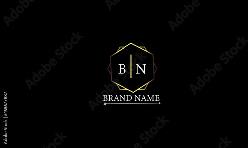 BN is a luxury logo with a classic golden color and attractive design with black background. photo