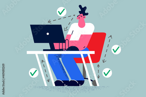 Smiling man work on computer in correct position 