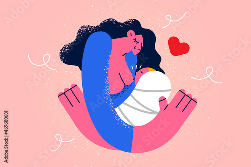 Caring mother breastfeeding newborn baby 