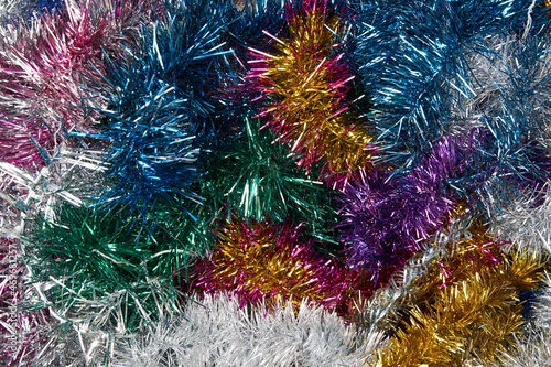 Multicolored shiny tinsel background  top view