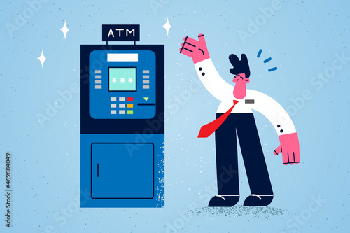 Smiling man use ATM machine for money withdrawal 