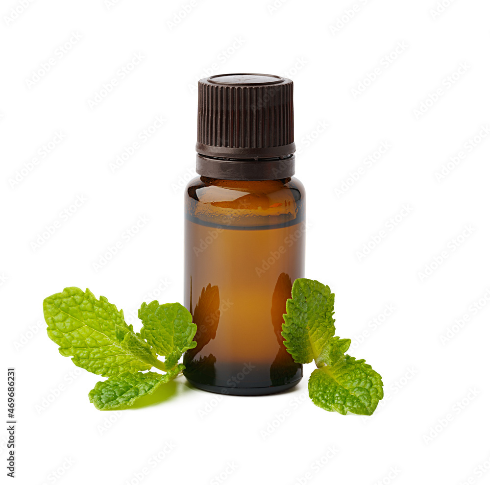 Bottle with essential oil and green leaf isolated on white background Bottle with essential oil and green leaf isolated on white background