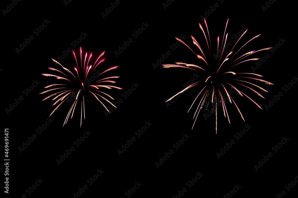 Fireworks on night sky, abstract light patterns. Black background with colorful, lightning effects. Long exposure and movement. Backdrops for Happy New Year cards, montage, copy space. Fireworks on night sky, abstract light patterns. Black background with colorful, lightning effects. Long exposure and movement. Backdrops for Happy New Year cards, montage, copy space.