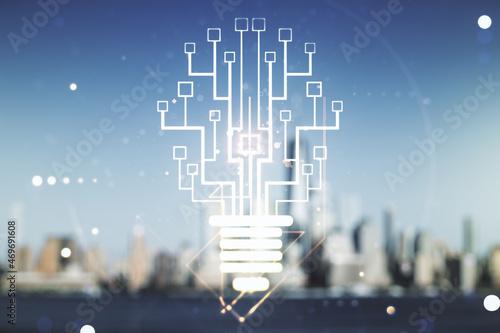 Double exposure of virtual creative light bulb hologram with chip on blurry cityscape background, idea and brainstorming concept