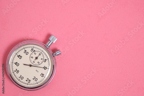 Stopwatch pink background.Doing sports and jogging.