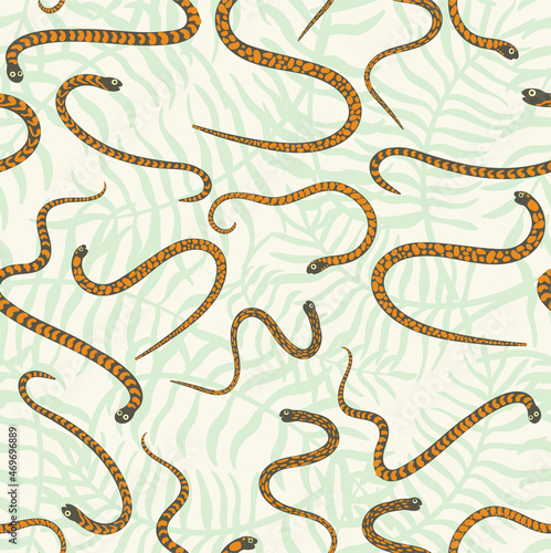 Cute and trendy vector seamless pattern with hand drawn snakes and palm leaves and tropical plants. Botanical and animalistic ornament for printing on fabrics and paper