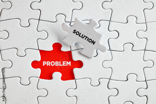 Problem and solution words on the missing puzzle pieces. To find a solution for a problem photo