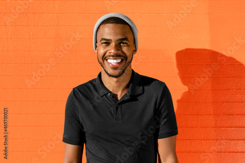 Teen boy portrait, African Amercian with bright wall background photo