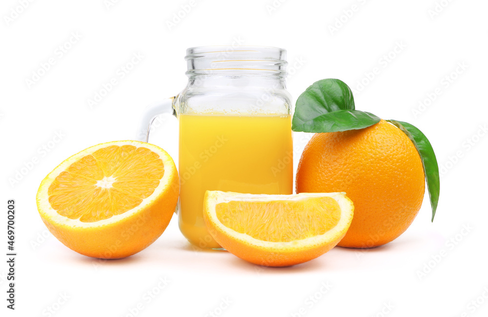 Orange juice in a glass isolated on a white background. Slice of orange fruit and green leaves. Orange juice in a jar Orange juice in a glass isolated on a white background. Slice of orange fruit and green leaves. Orange juice in a jar