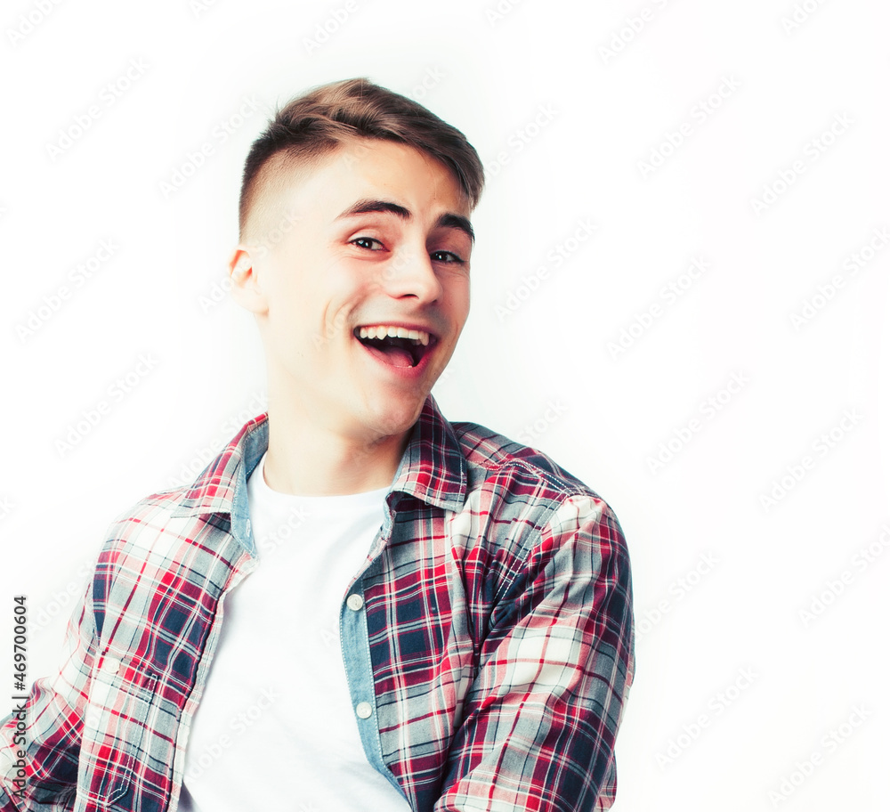 young handsome teenage hipster guy posing emotional, happy smiling against white background isolated, lifestyle people concept young handsome teenage hipster guy posing emotional, happy smiling against white background isolated, lifestyle people concept