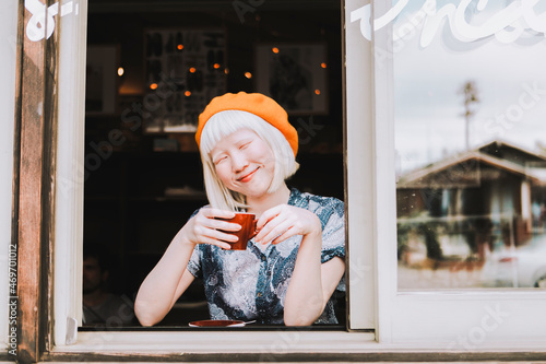 Albino girl at a cafe, white tone