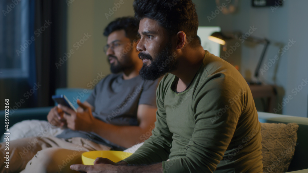 Indian fan discussing stakes with friends Indian fan discussing stakes with friends